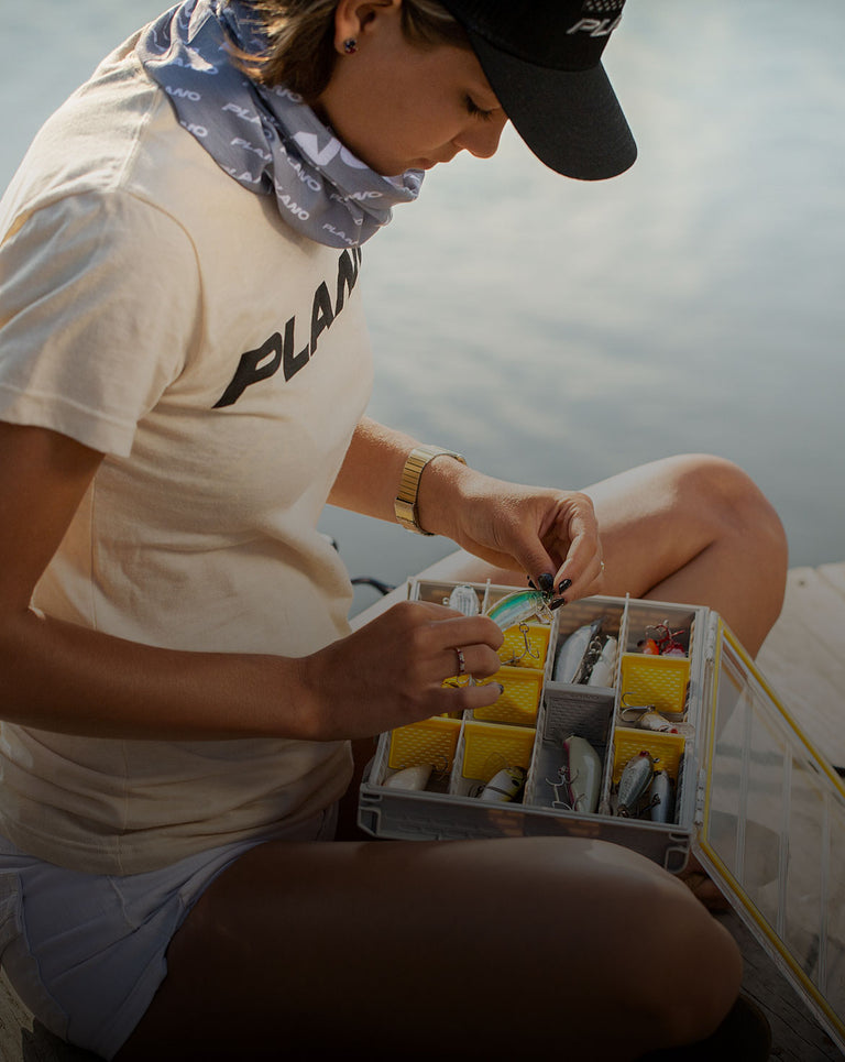 woman organizing baits in a plano edge stowaway box