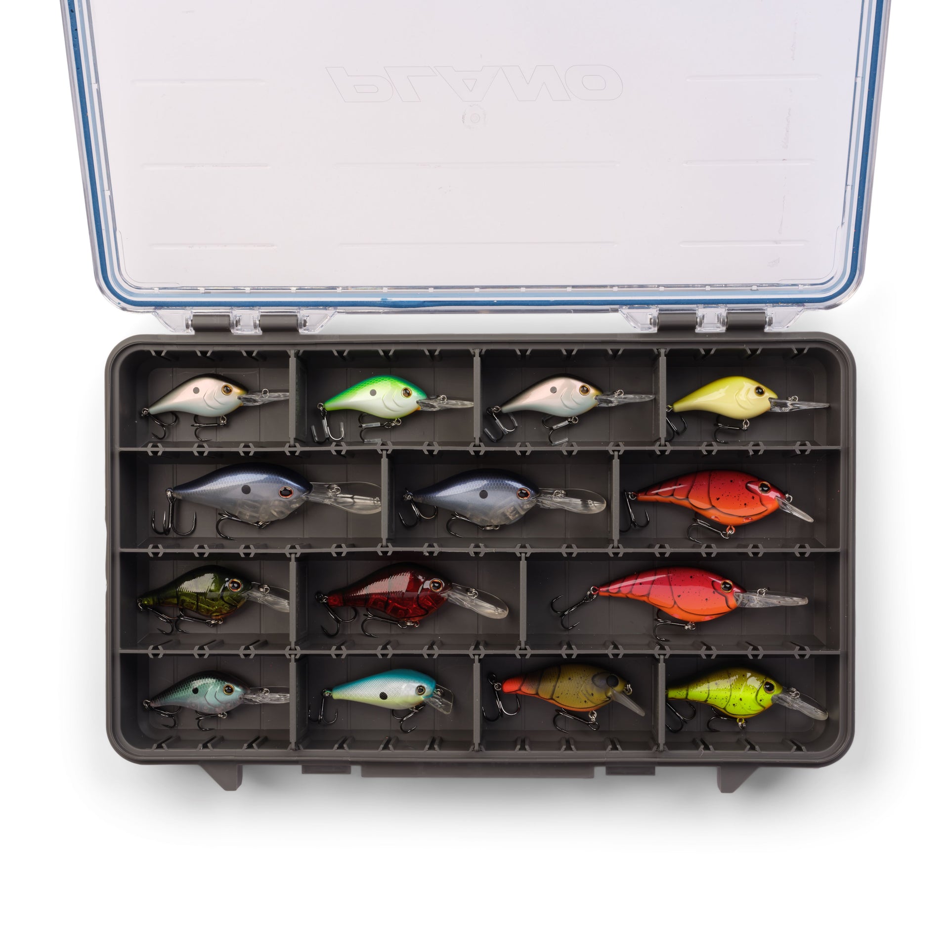 Assorted fishing lures in a tackle box on a white background